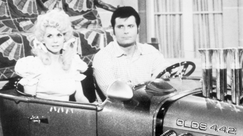 Donna Douglas and Max Baer Jr. in a car