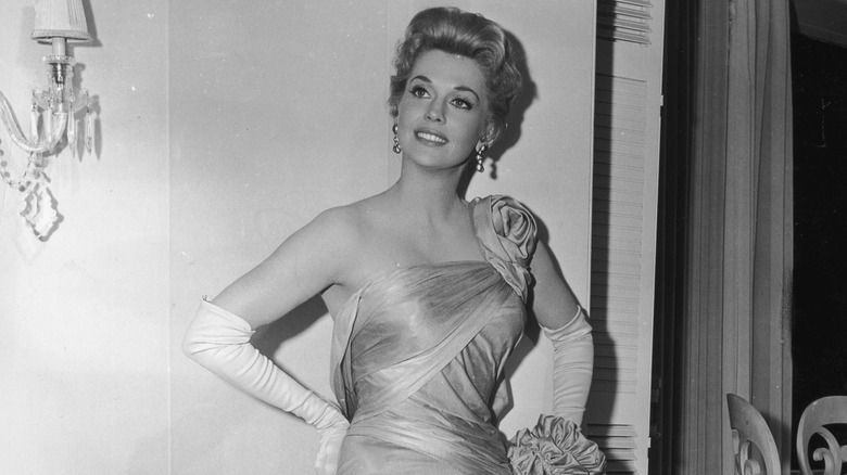 Donna Douglas wearing a dress and long gloves