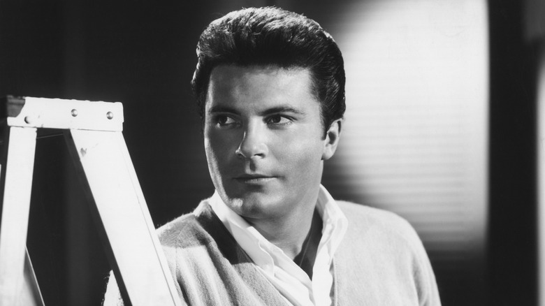Max Baer Jr. next to a ladder