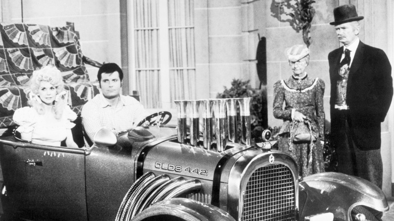 Donna Douglas and Max Baer Jr. in a car next to Irene Ryan and Buddy Ebsen