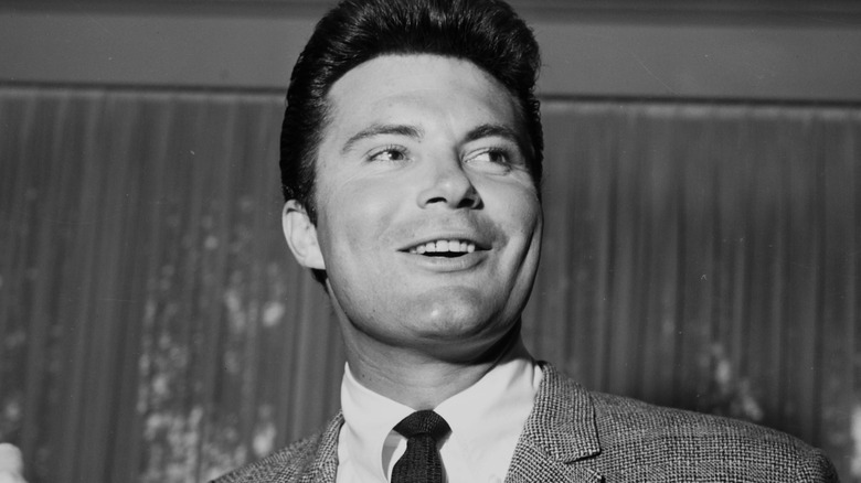Max Baer Jr. posing and smiling.