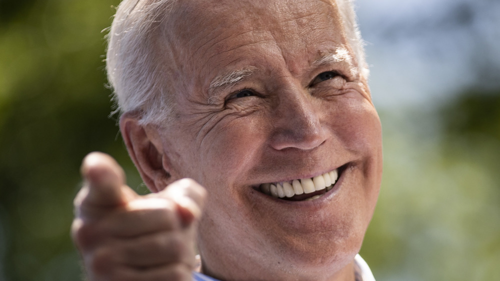 President Joe Biden looks elated onstage