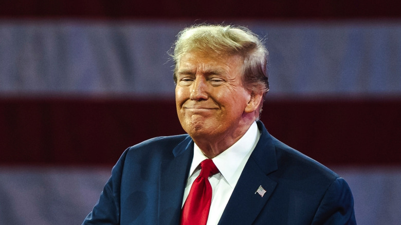 Donald Trump smiling at a political event