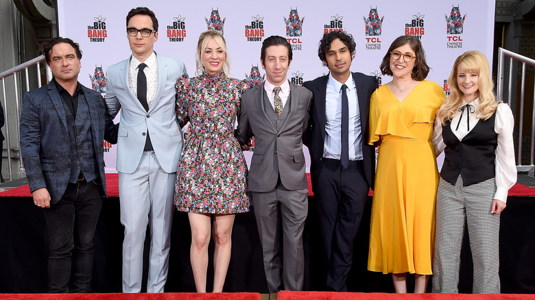 The cast of "The Big Bang Theory" posing at outdoor event