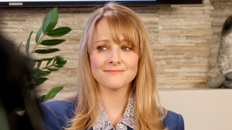 Melissa Rauch looking slightly miffed while sitting during an interview