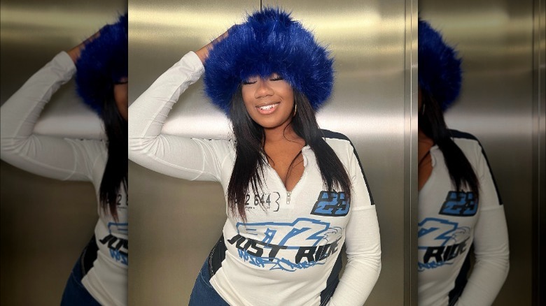 woman wearing blue fuzzy hat