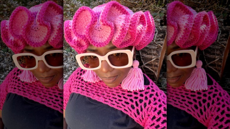woman wearing pink crochet ruffle hat 