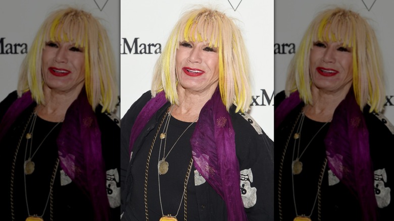 Betsey Johnson with tangled yellow hair extensions