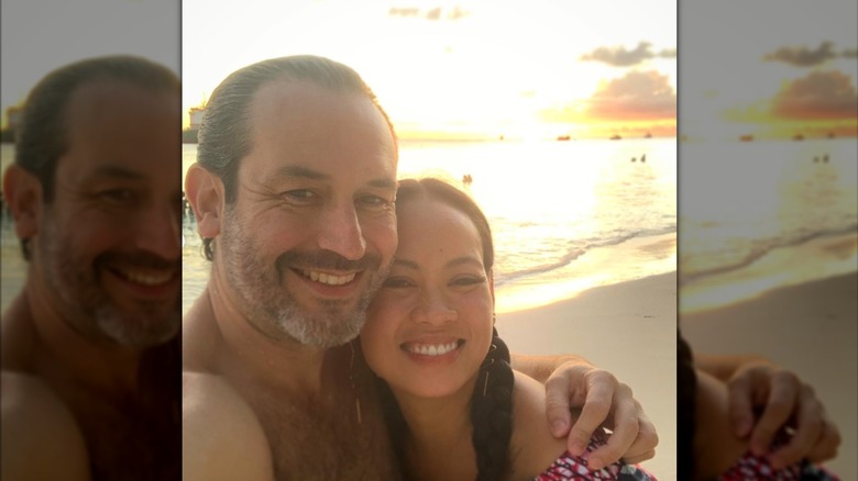 Wyatt Gallery and his wife Anya Ayoung-Chee smile for a sunset selfie