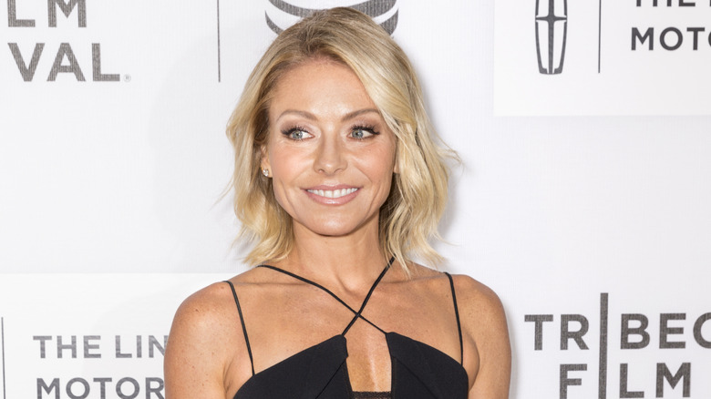 Kelly Ripa smiling and looking into the distance