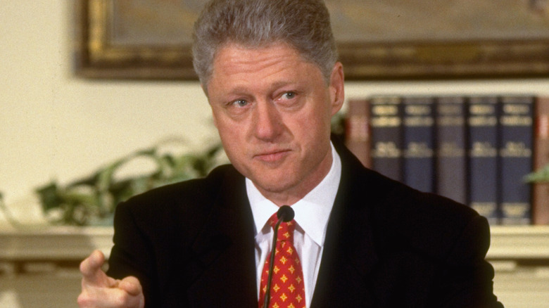 Bill Clinton speaking at podium