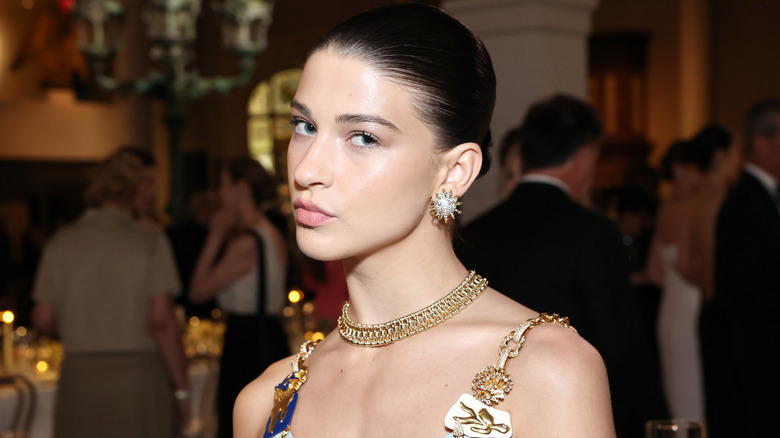 Phoebe Gates pouting as she gives a side-eye to the camera