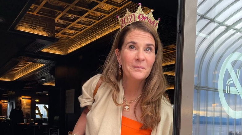 Melinda Gates with a mischievous smile wearing her daughter's 2021 graduation crown