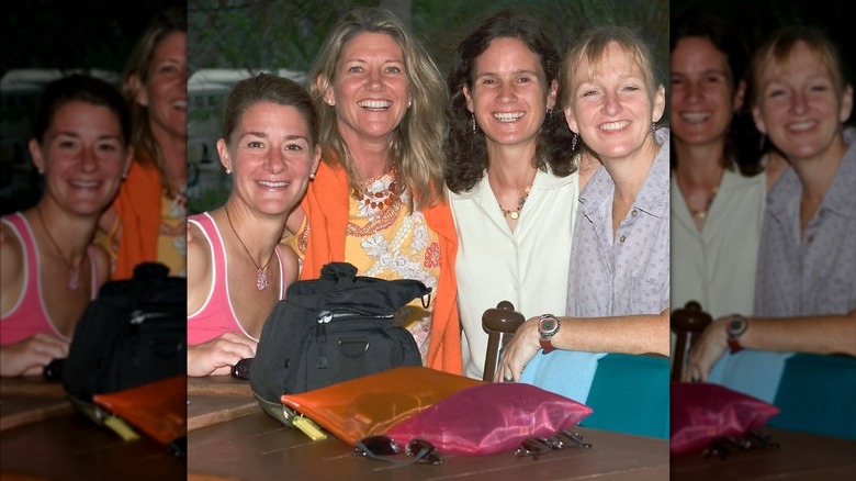 Melinda French Gates smiling and posing with three friends