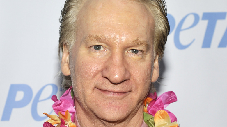 Bill Maher wearing a lei