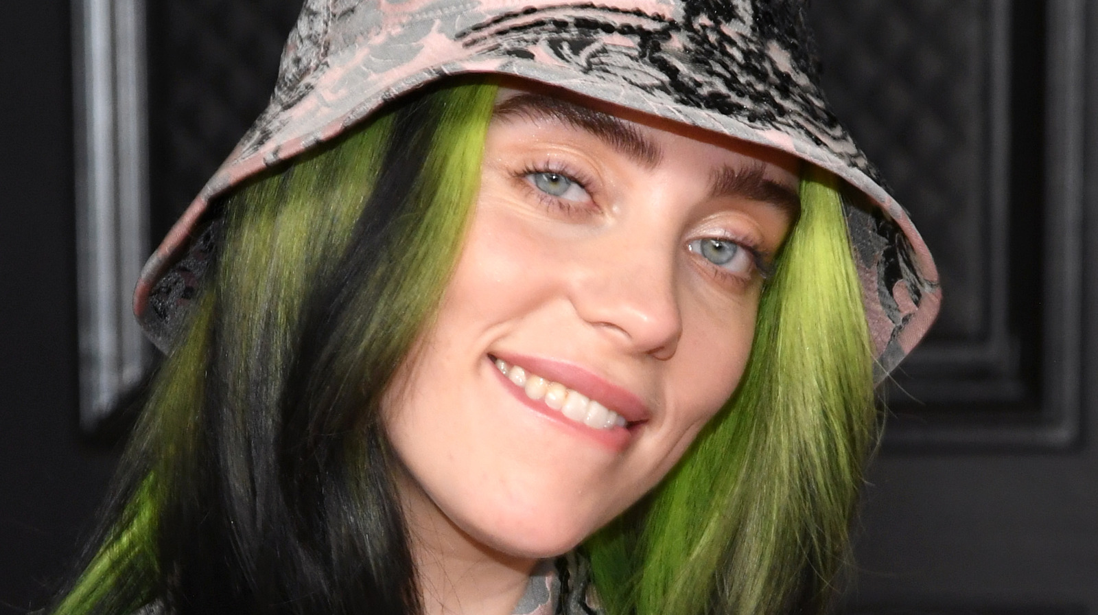 Billie Eilish's iconic green outfit and blue hair - wide 1