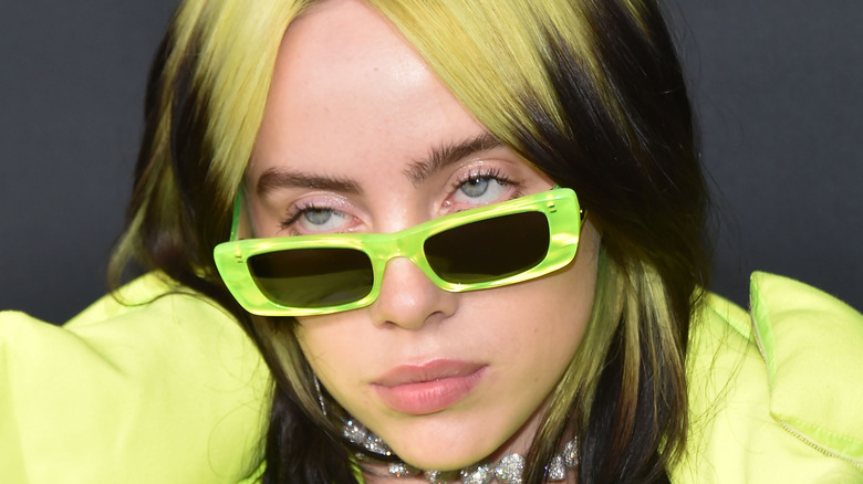 Billie Eilish posing in sunglasses