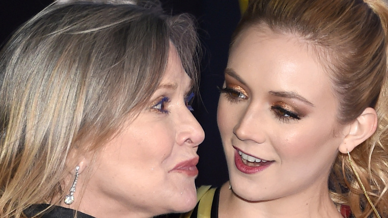 Carrie Fisher and Billie Lourd smiling at each other