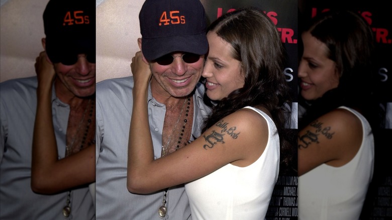 Billy Bob Thornton and Angelina Jolie embracing and smiling