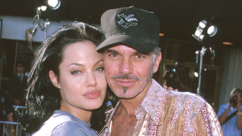 Angelia Jolie standing next to Billy Bob Thornton at a premiere