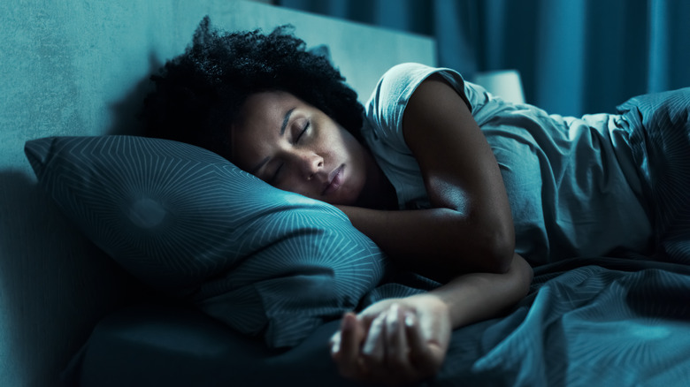 Woman sleeping at nighttime