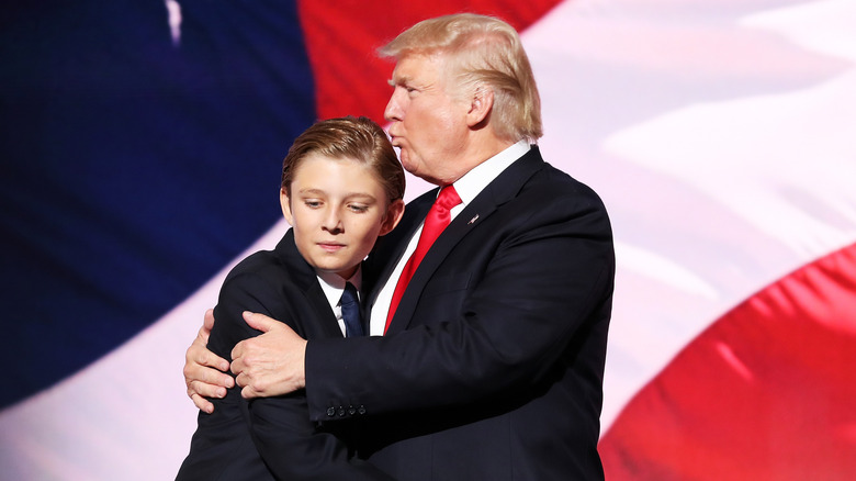 Donald Trump kissing Barron Trump on the head