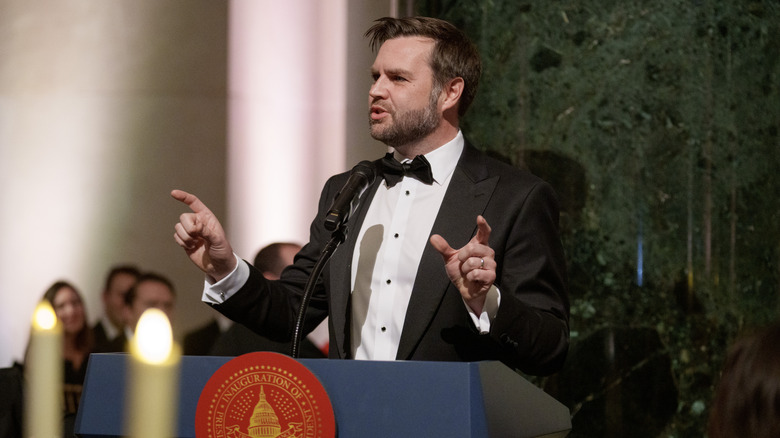 JD Vance talking while gesturing in a tuxedo