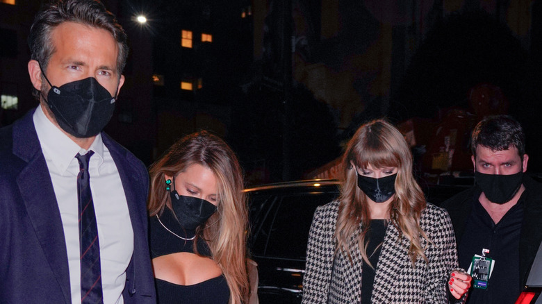Ryan Reynolds, Blake Lively, and Taylor Swift wearing masks
