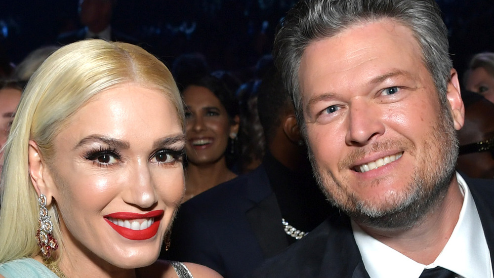 Blake Shelton and Gwen Stefani smiling at Grammy Awards