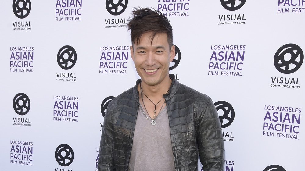 Bling Empire's Kevin Kreider poses on the red carpet