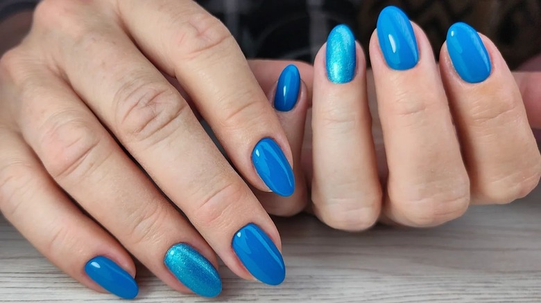 bright blue nails with one glitter