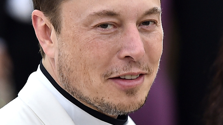 Elon Musk smiling red carpet