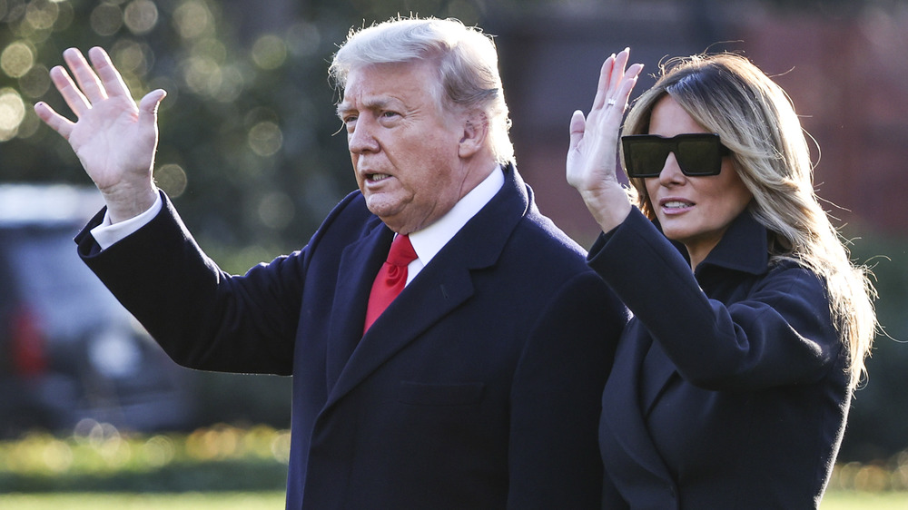 Melania Trump and Donald Trump waving