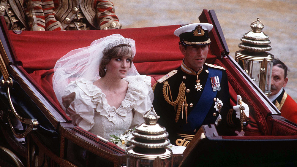 Princess Diana and Prince Charles riding in a carriage on their wedding day