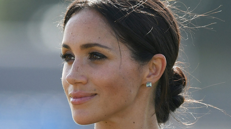 Meghan Markle posing outside