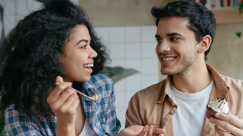 Couple eating dessert on a date