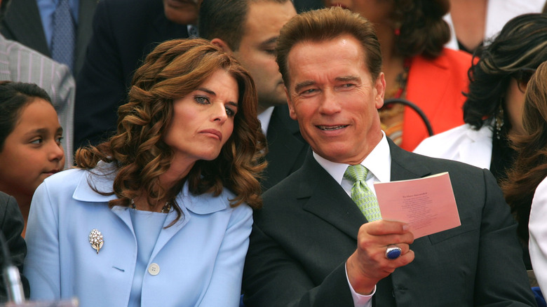 Maria Shriver and Arnold Schwarzenegger talking 