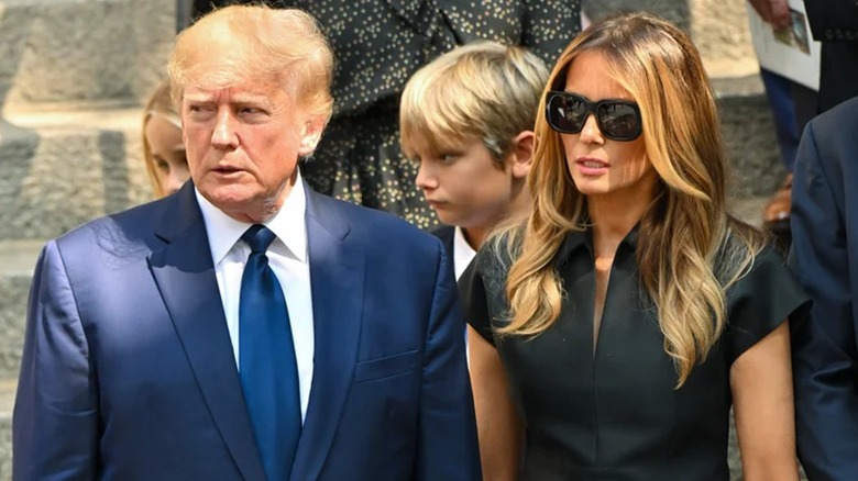 Donald and Melania Trump stand side by side