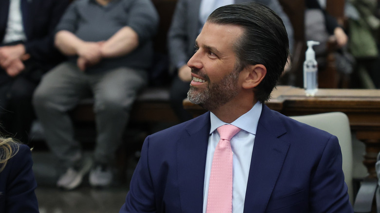 Donald Trump Jr. in the courthouse, grinning