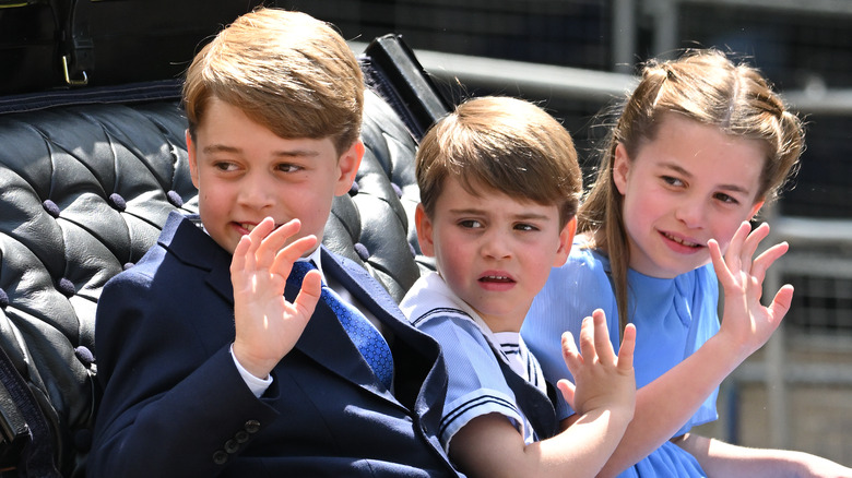 Prince George, Prince Louis, and Princess Charlotte wave from coach