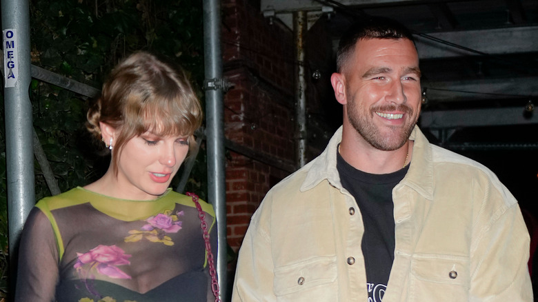 Taylor Swift and Travis Kelce smiling