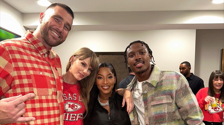 Travis Kelce, Taylor Swift, Chariah Gordon, and Mecole Hardman, Jr. smiling
