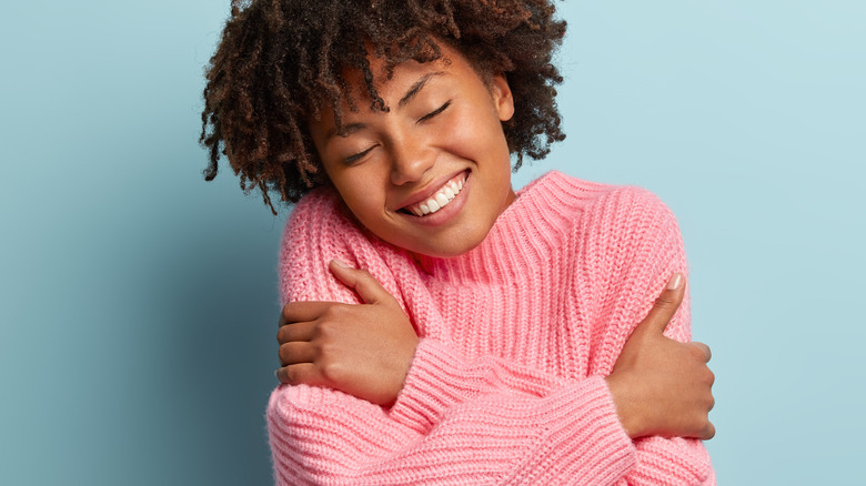 Woman in pink sweater 