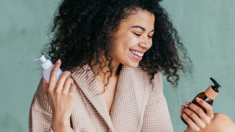 Woman holding skincare products