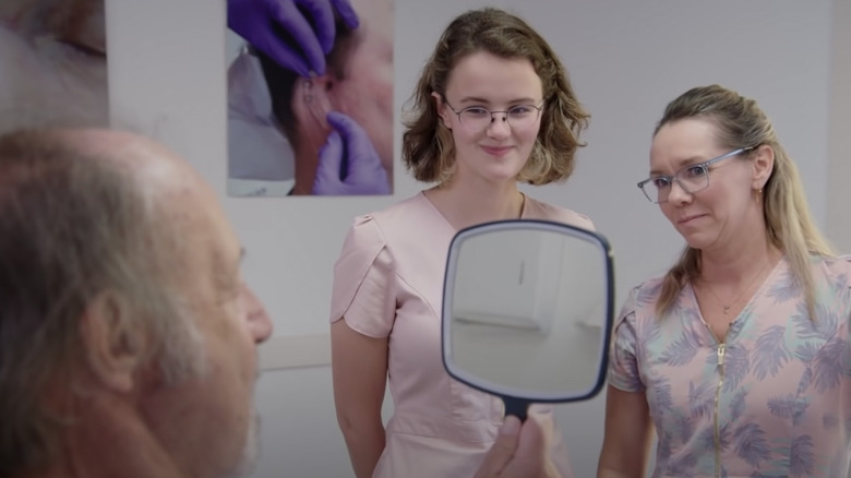 Patient examining Allison Vest's work on TLC show "Body Parts"