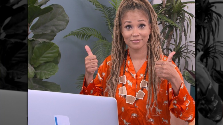 Breegan Jane smiling with her thumbs up