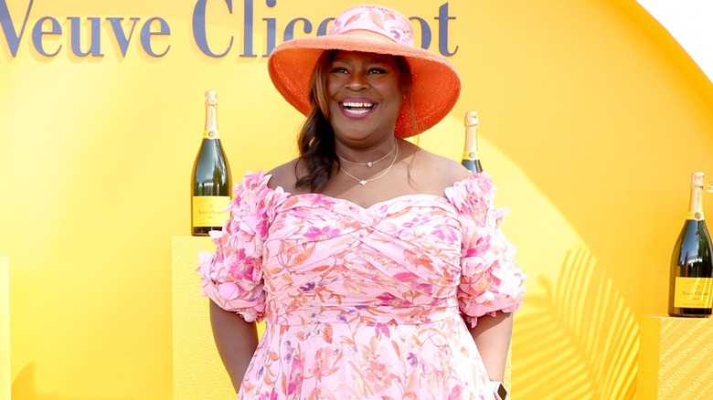 Retta smiling for a camera