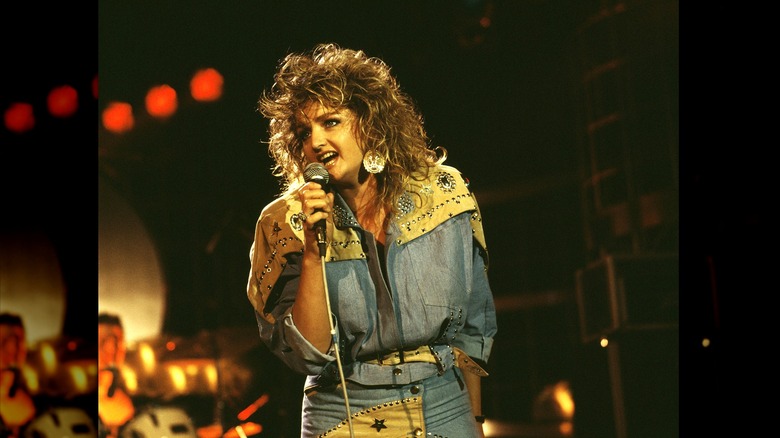 Bonnie Tyler performing in denim cowgirl style