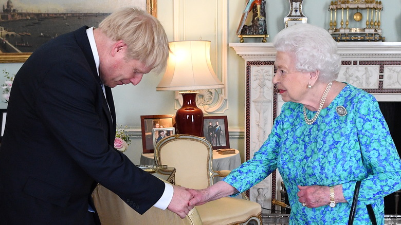 Boris Johnson bowing to Queen Elizabeth II