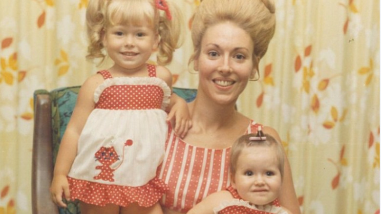 Kelly Ripa as a child with her mother and sibling.